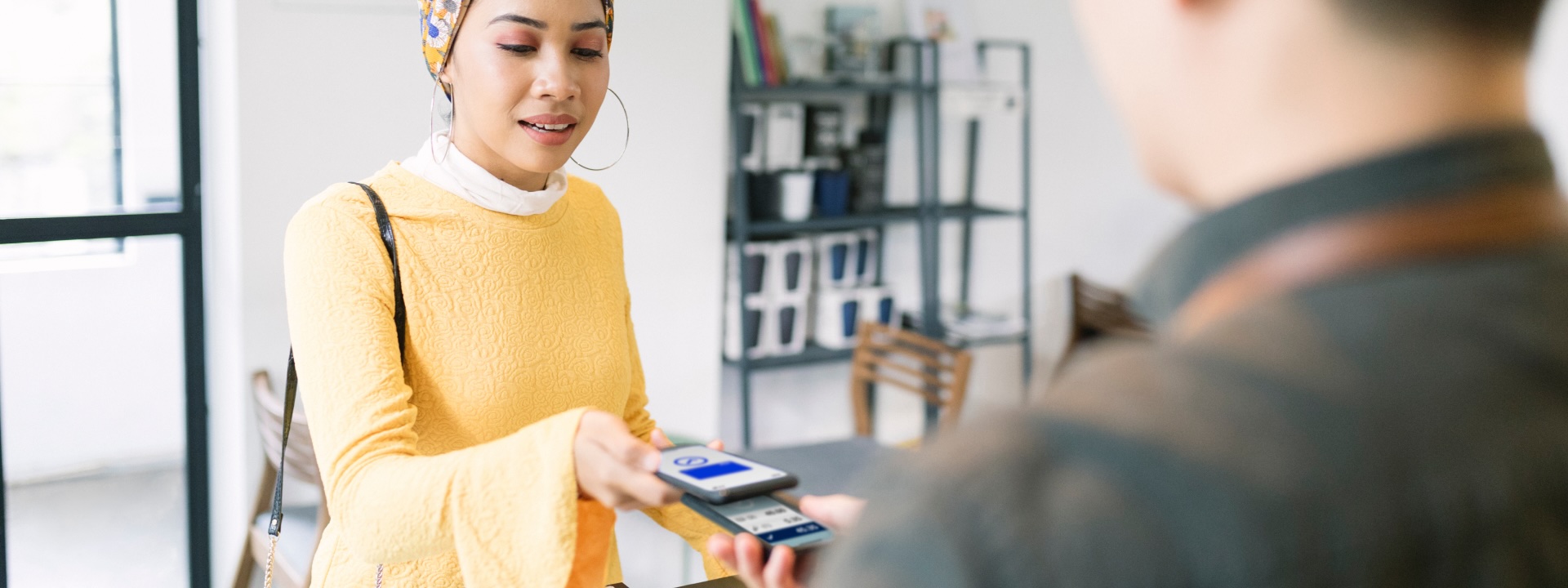 Person tapping to pay